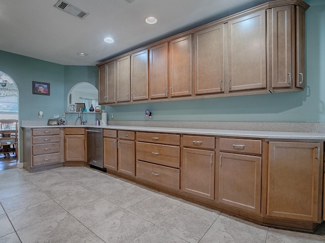 kitchen with dishwasher, light tile patterned flooring, and sink