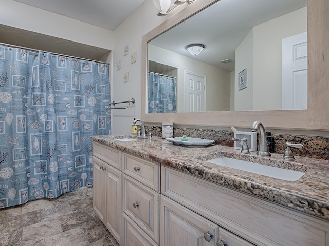 bathroom featuring vanity and a shower with shower curtain