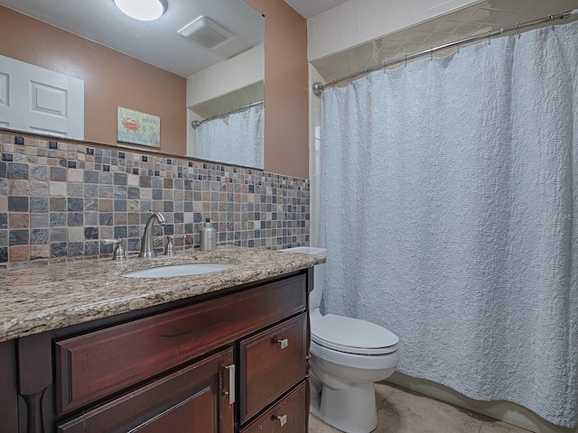 bathroom featuring vanity, a shower with shower curtain, toilet, and tasteful backsplash