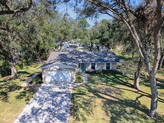 view of front facade featuring a garage and a front lawn