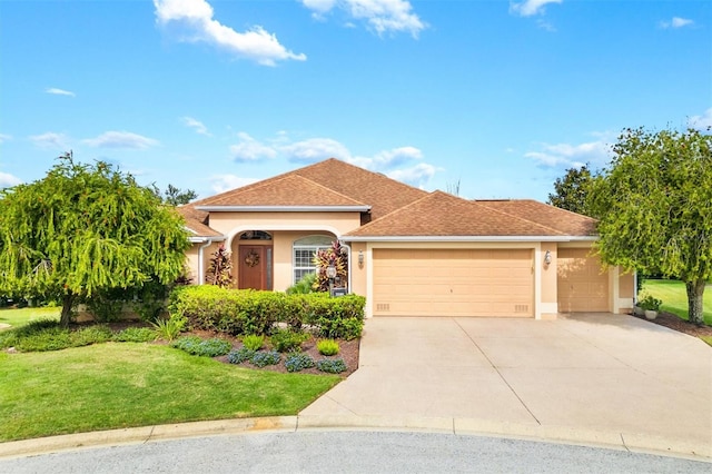 view of front of house with a front lawn and a garage