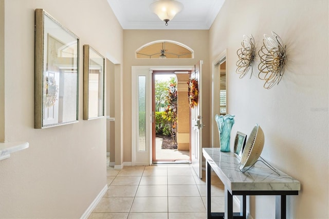 doorway to outside with ornamental molding, light tile patterned floors, and a healthy amount of sunlight