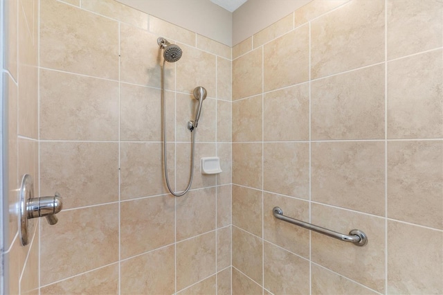 bathroom with tiled shower