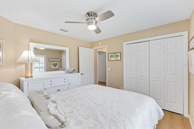 bedroom featuring a closet, ceiling fan, and light hardwood / wood-style floors