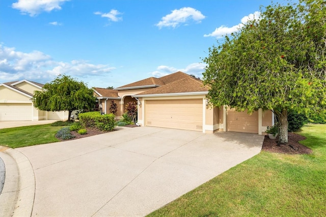 view of front of property with a front yard and a garage