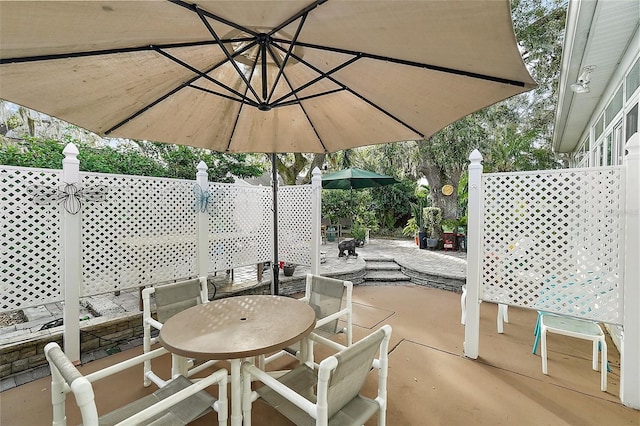 3721 Plantation Blvd, Leesburg, FL 34748 - view of patio featuring outdoor dining space and fence
