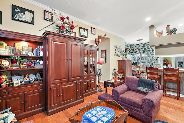 3721 Plantation Blvd, Leesburg, FL 34748 - living area featuring light wood-style flooring and crown molding