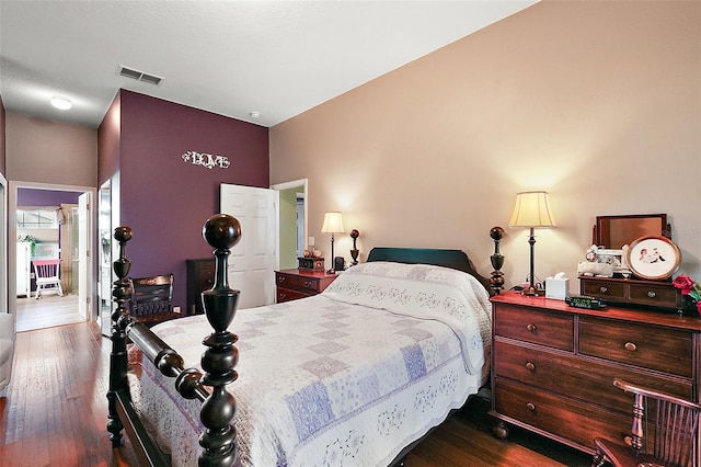 bedroom with hardwood / wood-style flooring