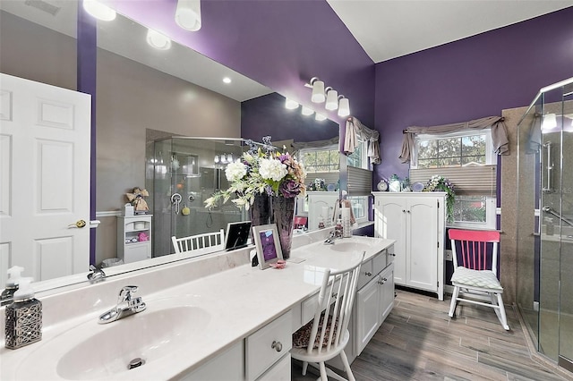 3721 Plantation Blvd, Leesburg, FL 34748 - bathroom with vanity, a shower stall, and wood finished floors