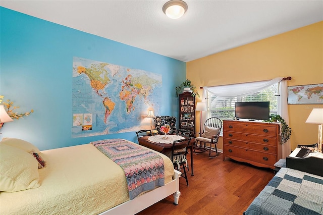 bedroom with wood-type flooring