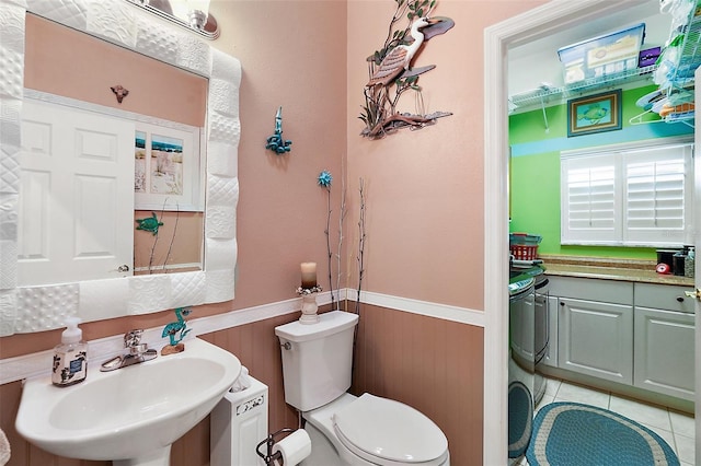 3721 Plantation Blvd, Leesburg, FL 34748 - half bath with a sink, toilet, a wainscoted wall, and wood walls