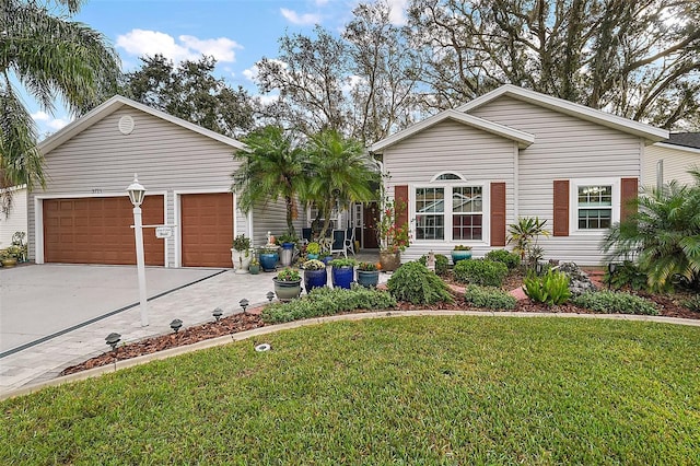 single story home featuring a front lawn and a garage