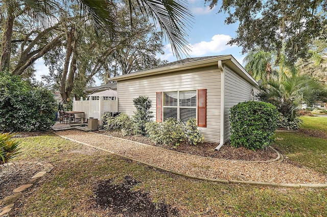 view of side of property with cooling unit