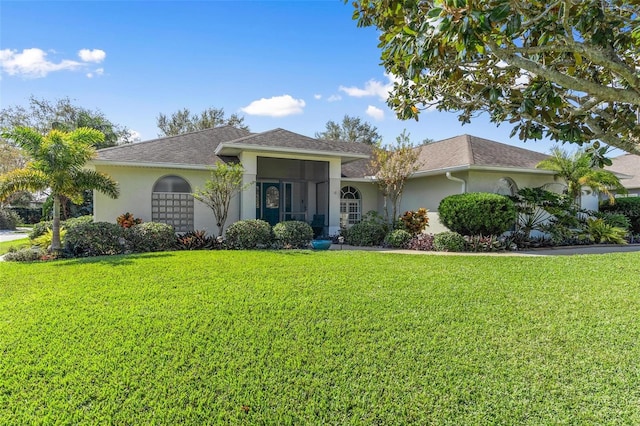 single story home featuring a front yard