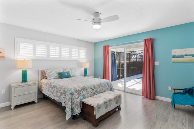 bedroom featuring ceiling fan, light hardwood / wood-style floors, and access to outside