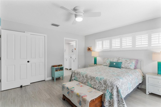 bedroom with ceiling fan, light wood-type flooring, and a closet