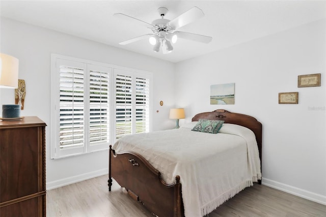 bedroom featuring light hardwood / wood-style floors and ceiling fan