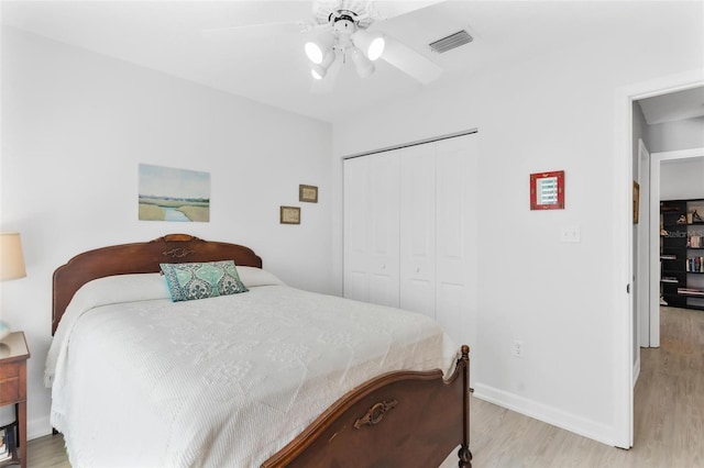 bedroom featuring a closet, ceiling fan, and light hardwood / wood-style floors