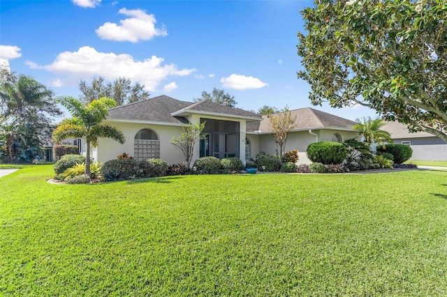 ranch-style home featuring a front yard