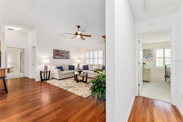 living room featuring hardwood / wood-style flooring, ceiling fan, plenty of natural light, and lofted ceiling