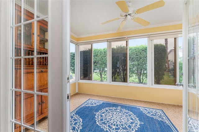 sunroom / solarium with ceiling fan and plenty of natural light