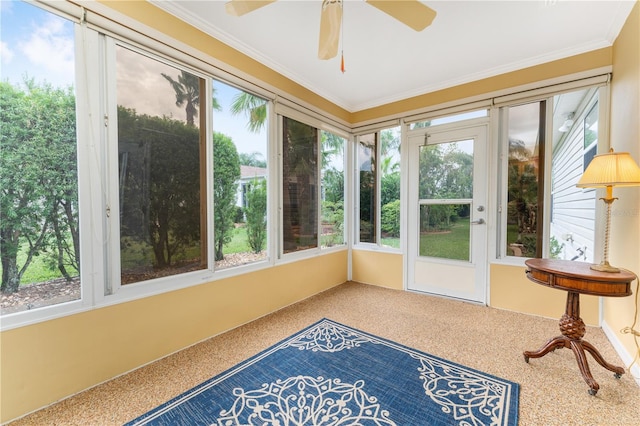 sunroom with ceiling fan and plenty of natural light