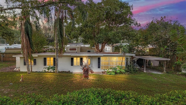 view of front of property with a yard