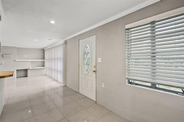 foyer entrance with ornamental molding