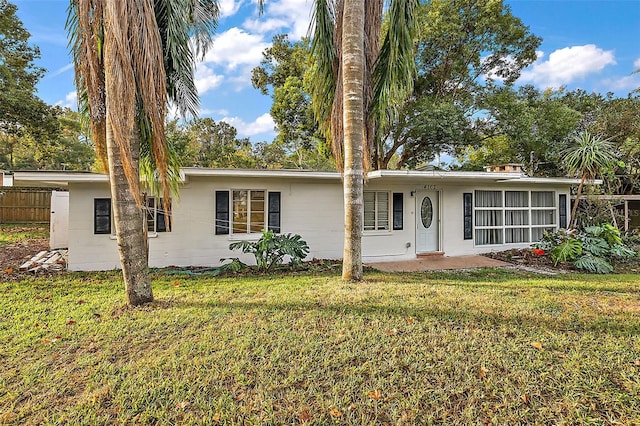 ranch-style house with a front yard