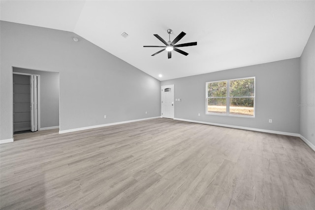 interior space with ceiling fan, vaulted ceiling, and light hardwood / wood-style flooring