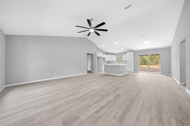 unfurnished living room with ceiling fan, light hardwood / wood-style floors, and lofted ceiling