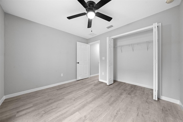 unfurnished bedroom with ceiling fan, a closet, and light hardwood / wood-style floors