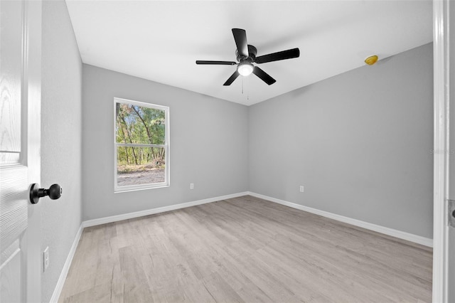 spare room with ceiling fan and light hardwood / wood-style floors