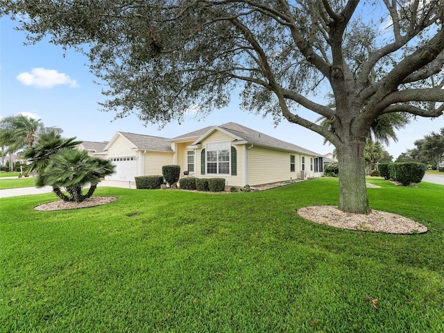 view of home's exterior featuring a garage and a lawn