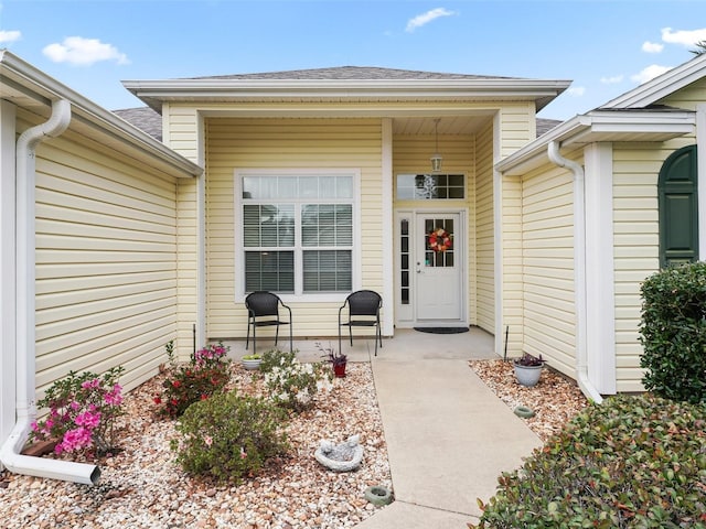 property entrance featuring a patio