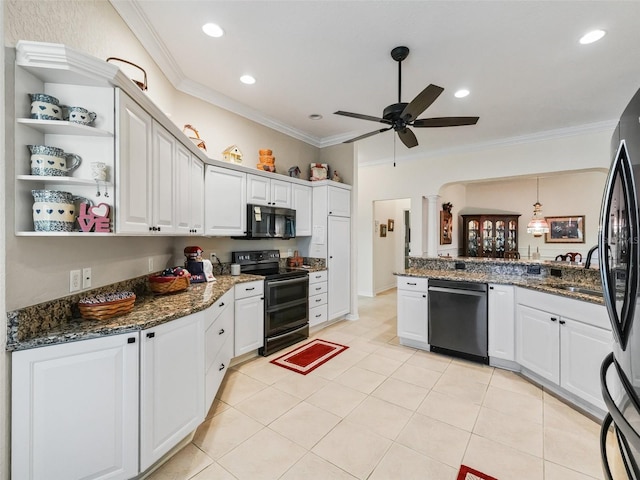 kitchen featuring ornamental molding, white cabinetry, dark stone counters, and black appliances