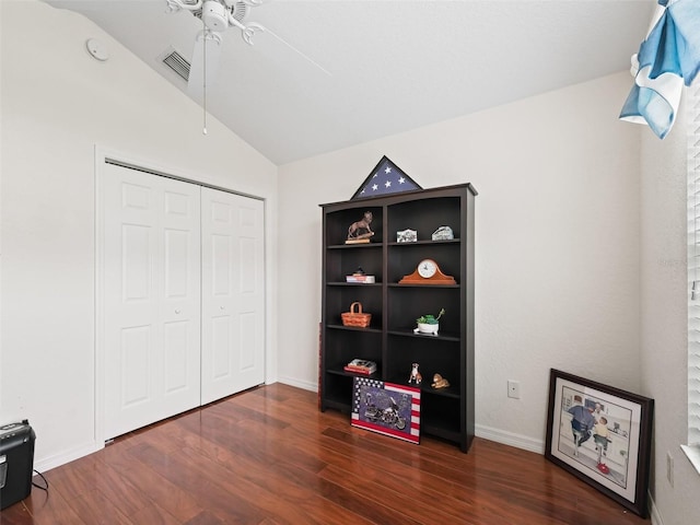 misc room featuring ceiling fan, lofted ceiling, and dark wood-type flooring