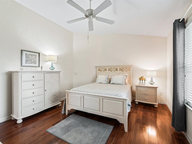 bedroom featuring lofted ceiling, ceiling fan, and dark hardwood / wood-style floors