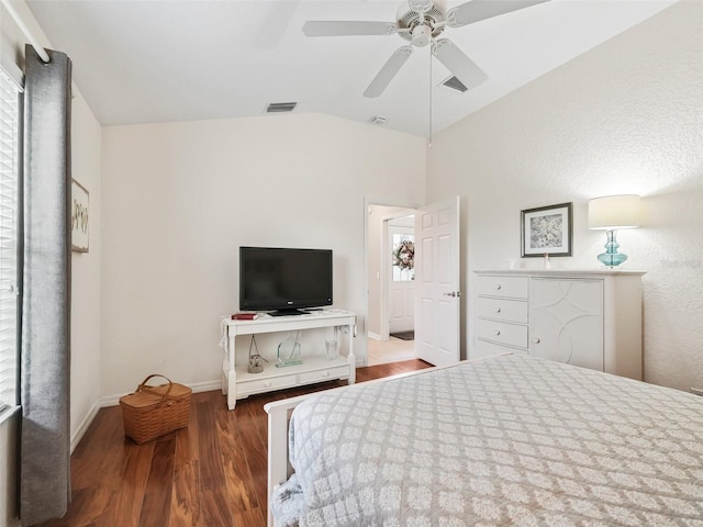 bedroom featuring hardwood / wood-style floors, ceiling fan, and lofted ceiling