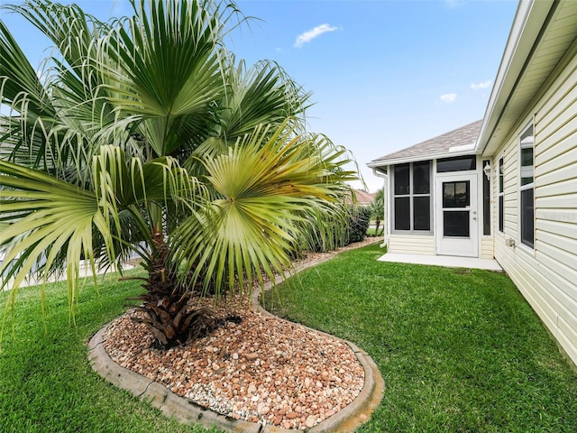 view of yard with a sunroom