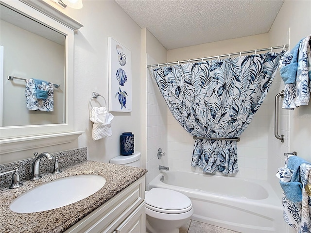 full bathroom with toilet, vanity, a textured ceiling, and tile patterned flooring