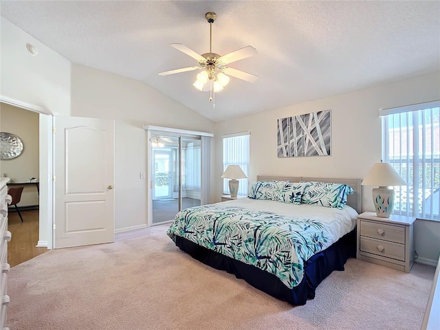 bedroom with access to exterior, light carpet, multiple windows, and ceiling fan