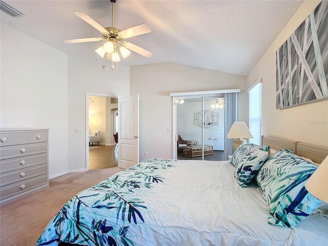 bedroom featuring carpet, vaulted ceiling, ceiling fan, and a textured ceiling