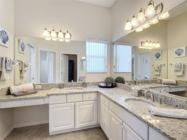 bathroom with tile patterned flooring and vanity