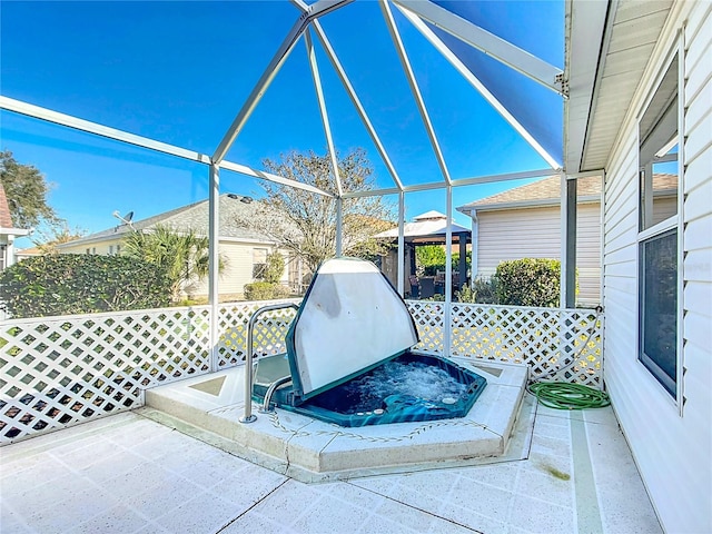 view of patio with a lanai and a gazebo