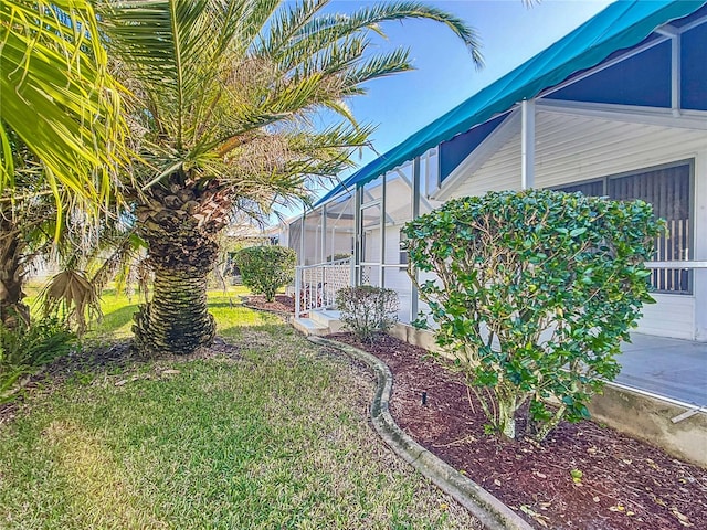 view of yard featuring a lanai