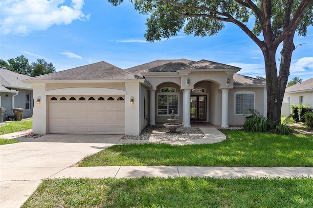 view of front facade featuring a garage and a front yard