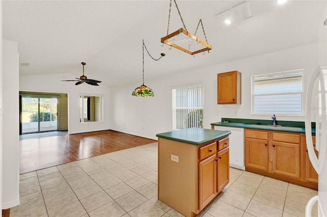 kitchen featuring a kitchen island, light wood-type flooring, dishwasher, lofted ceiling, and ceiling fan