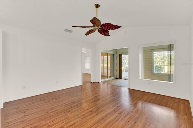 spare room featuring vaulted ceiling, ceiling fan, and light hardwood / wood-style flooring