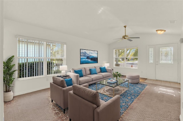 living room featuring carpet floors, ceiling fan, and vaulted ceiling